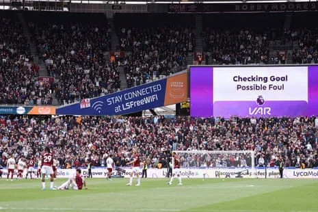 Players wait for the VAR check that ruled out Callum Wilson’s late goal for West Ham against Arsenal on Sunday