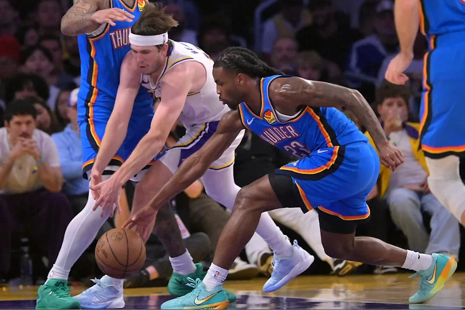 May 9, 2026; Los Angeles, California, USA; Oklahoma City Thunder guard Cason Wallace (22) steals the ball from Los Angeles Lakers guard Austin Reaves (15) in the second half of game three of the second round of the 2026 NBA Playoffs at Crypto.com Arena. Mandatory Credit: Jayne Kamin-Oncea-Imagn Images