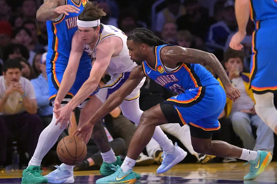 May 9, 2026; Los Angeles, California, USA; Oklahoma City Thunder guard Cason Wallace (22) steals the ball from Los Angeles Lakers guard Austin Reaves (15) in the second half of game three of the second round of the 2026 NBA Playoffs at Crypto.com Arena. Mandatory Credit: Jayne Kamin-Oncea-Imagn Images